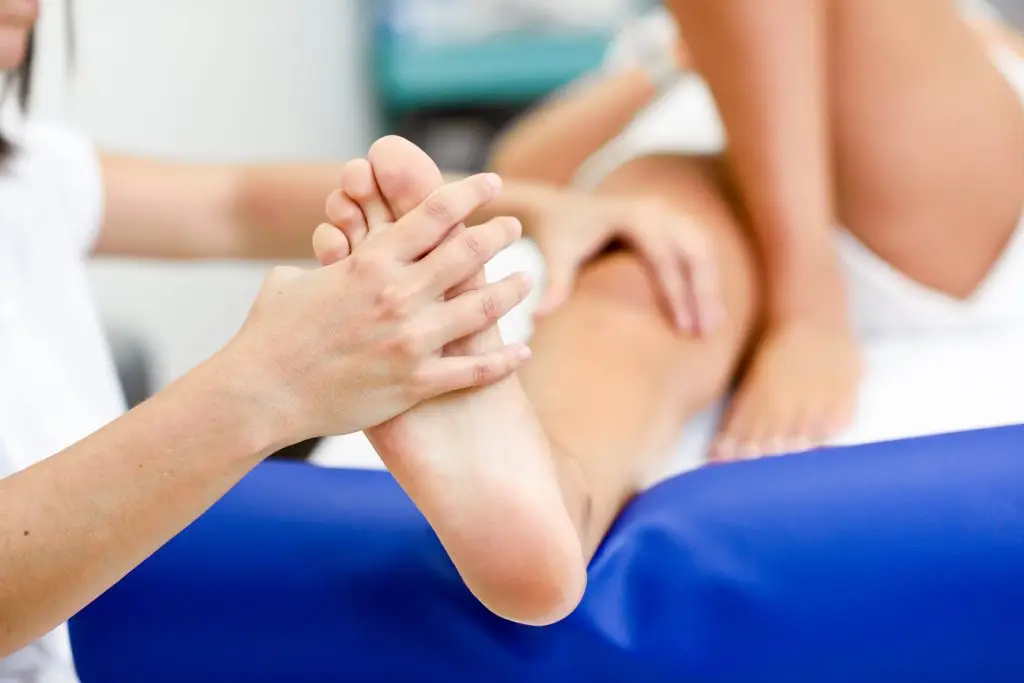 foot examination prior to ankle replacement surgery